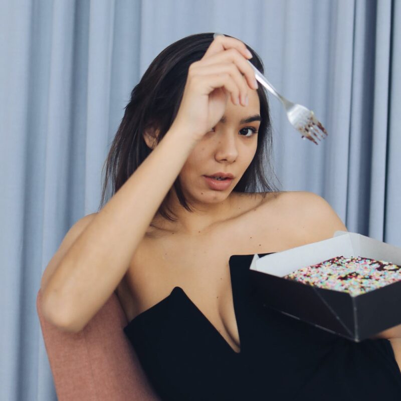 Poly woman eating cake