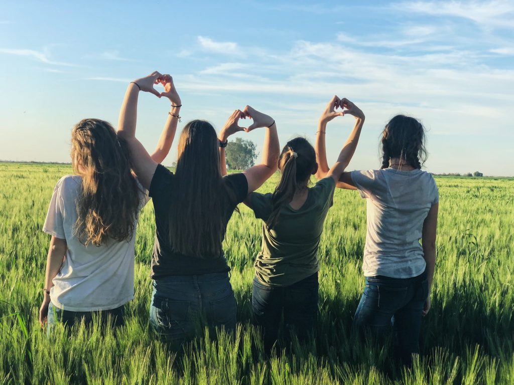 four women embracing poly lifestyle