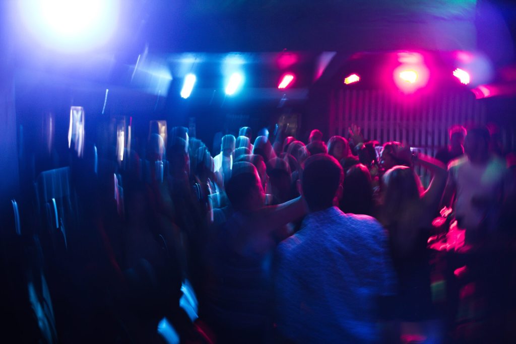 people dancing at a swingers club