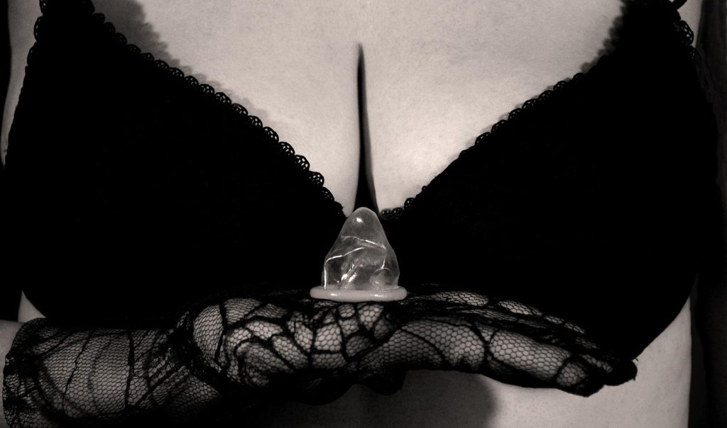 woman reminding camera of proper sex party etiquette