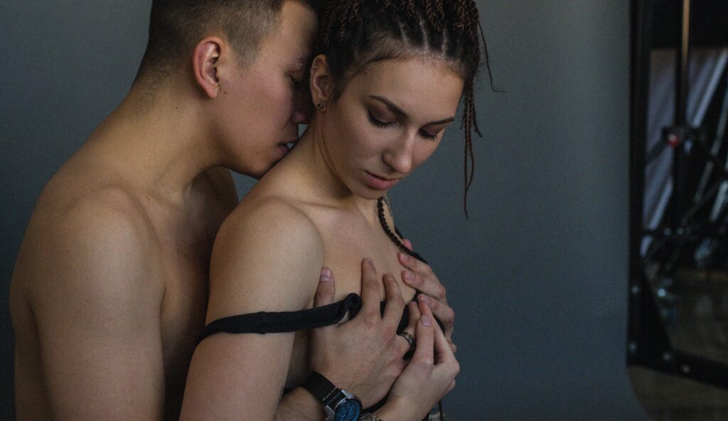 Man Embracing woman at a private sex club