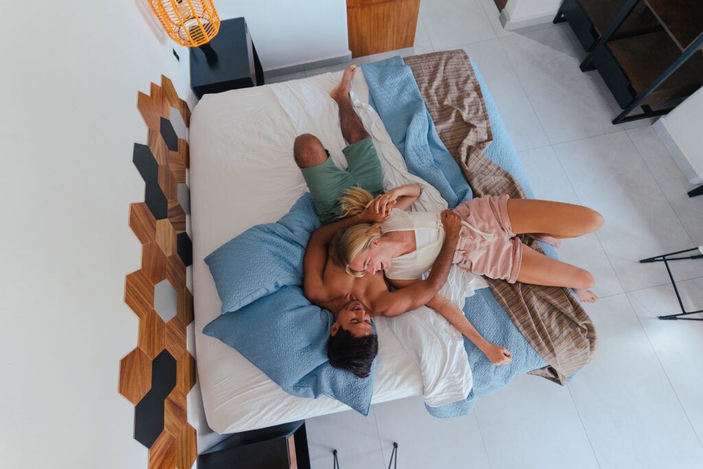 two people laying in bed discussing casual sex rules