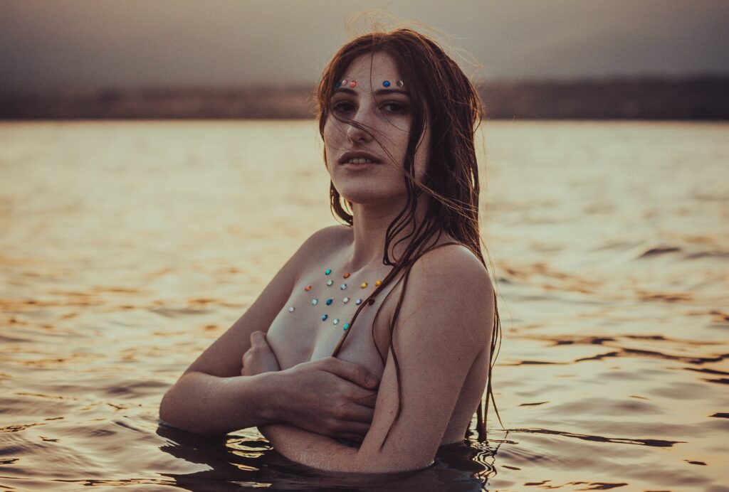 Woman in the water at a nude beach