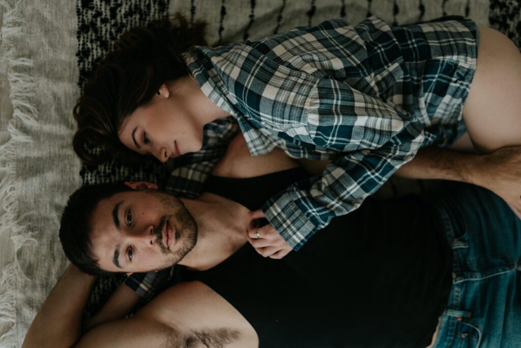 A Swinger Couple Lying in Bed
