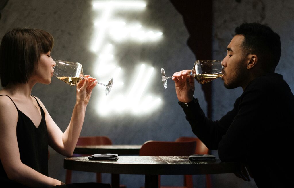 swinger couple drinking wine