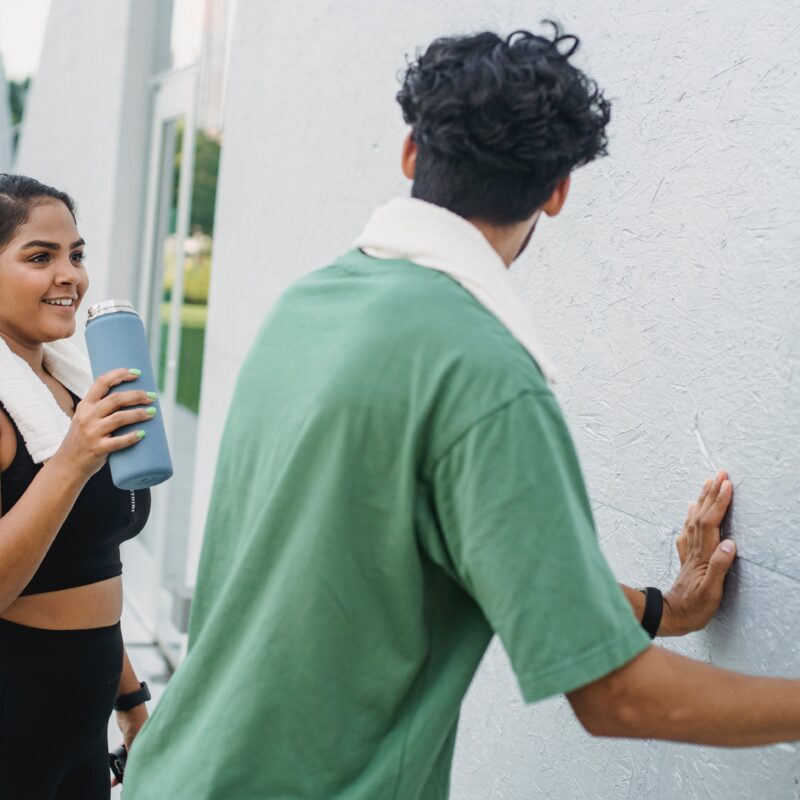 Swinger Couple Working Out Together Outdoors