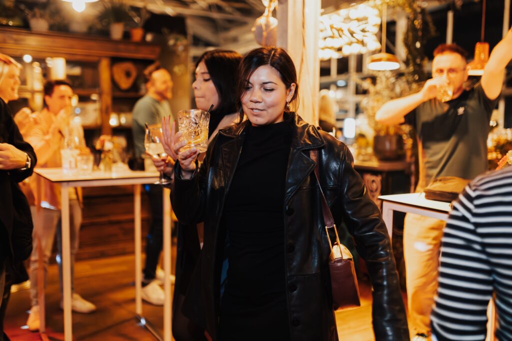 Woman with a Drink in her Hand at a Swinger Party