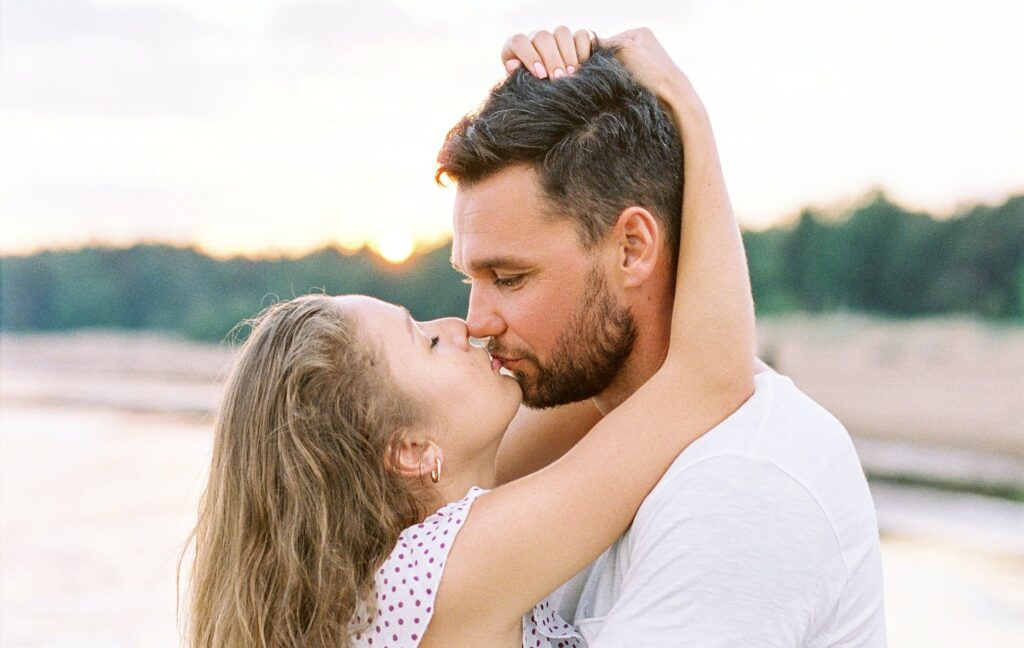 A Swinger Couple Kissing Each Other
