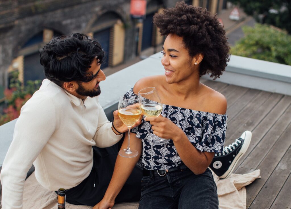 swinger couple with wine celebrating a milestone