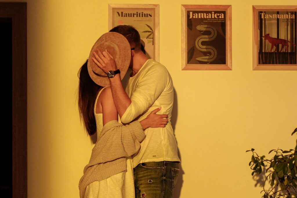 kissing behind the hat