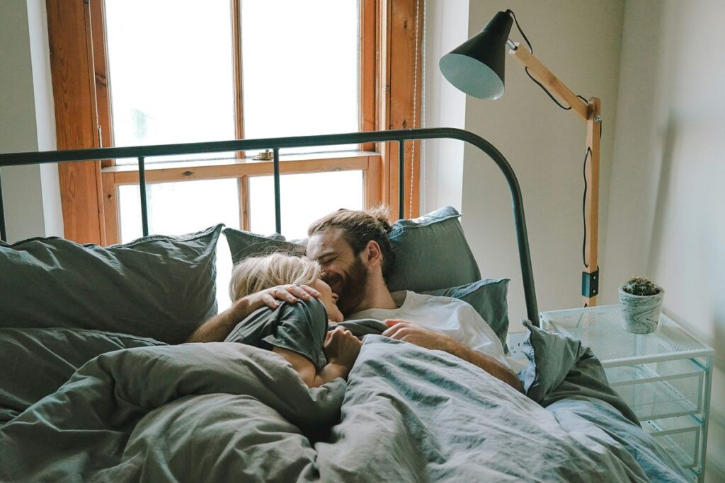 couple in bed experiencing compersion