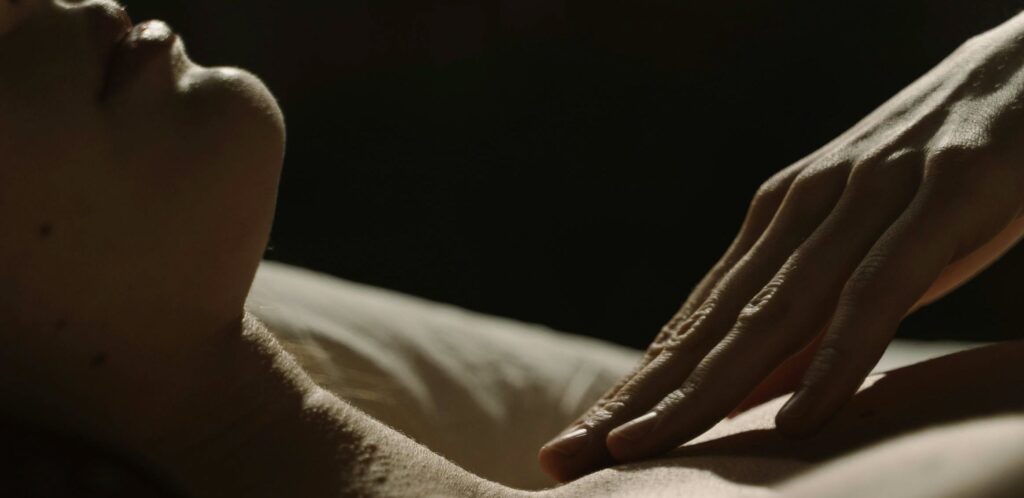 Close-up of a Woman Neck Touched on the Collarbone