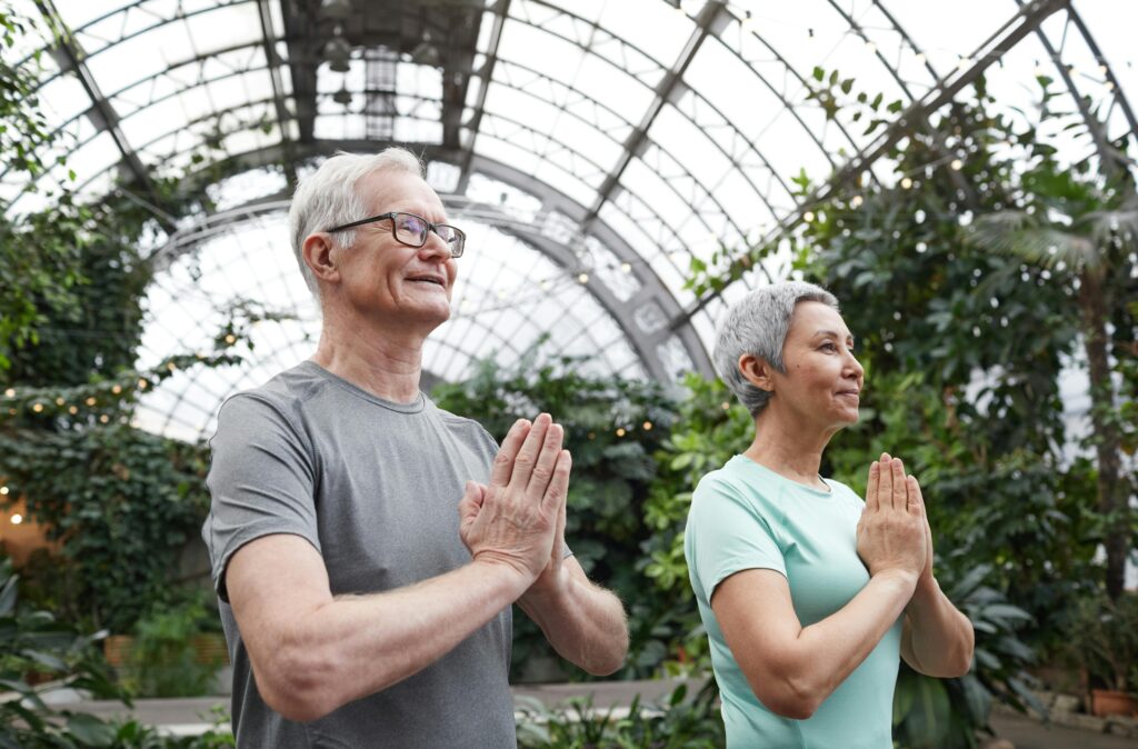 Older couple doing yoga together