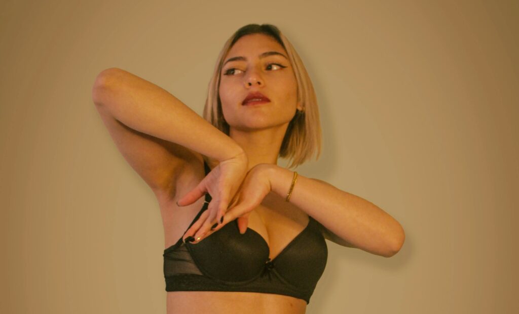 Woman in Posing in Her Black Bra