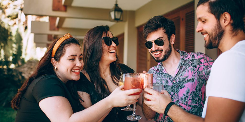 two men and women drinking 