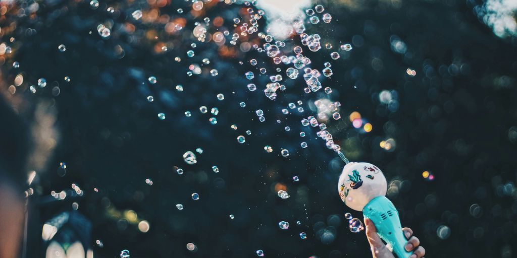 person's hand holding bubble toy