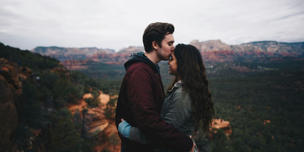 men kissing forehead of a women 