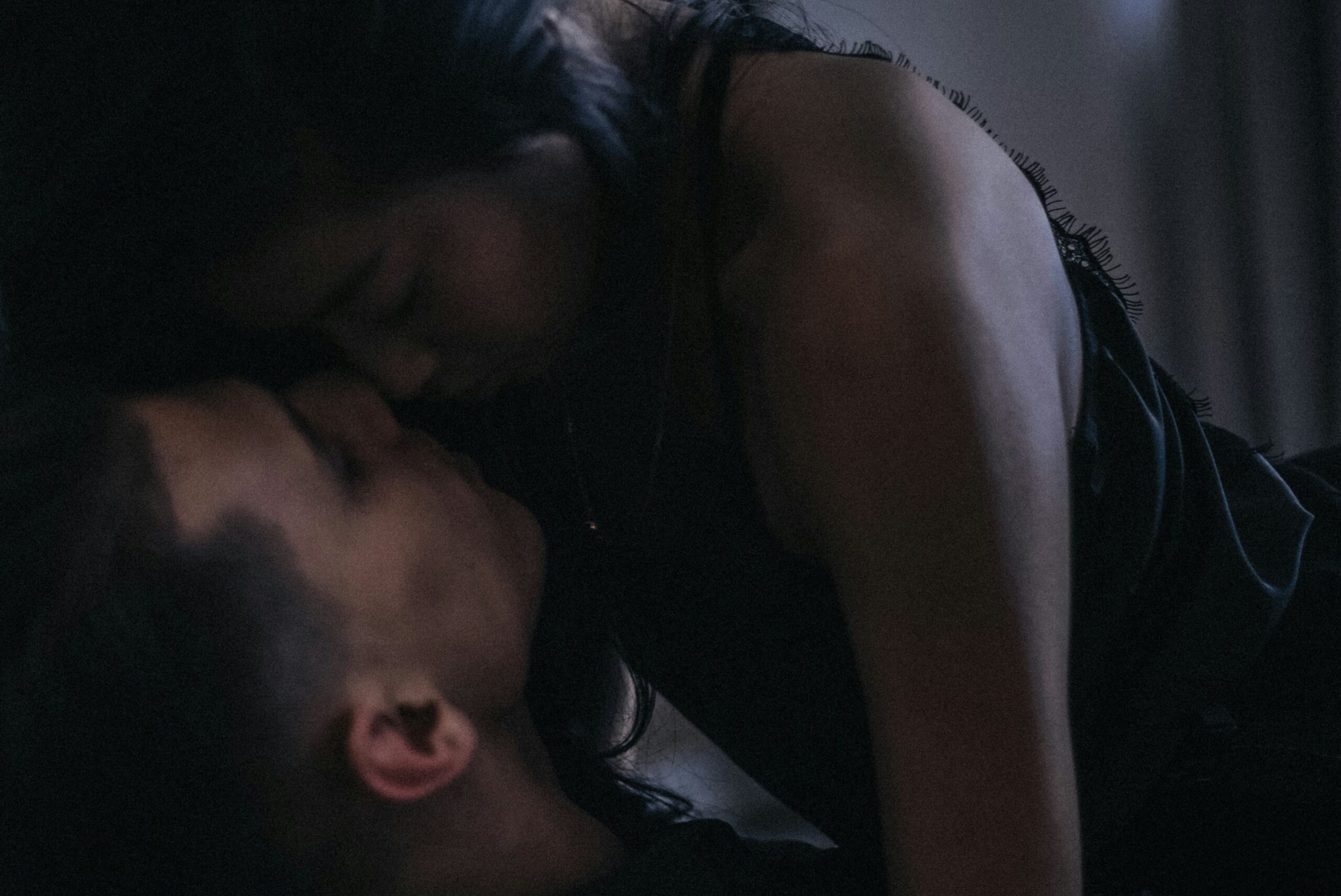 man and woman kissing