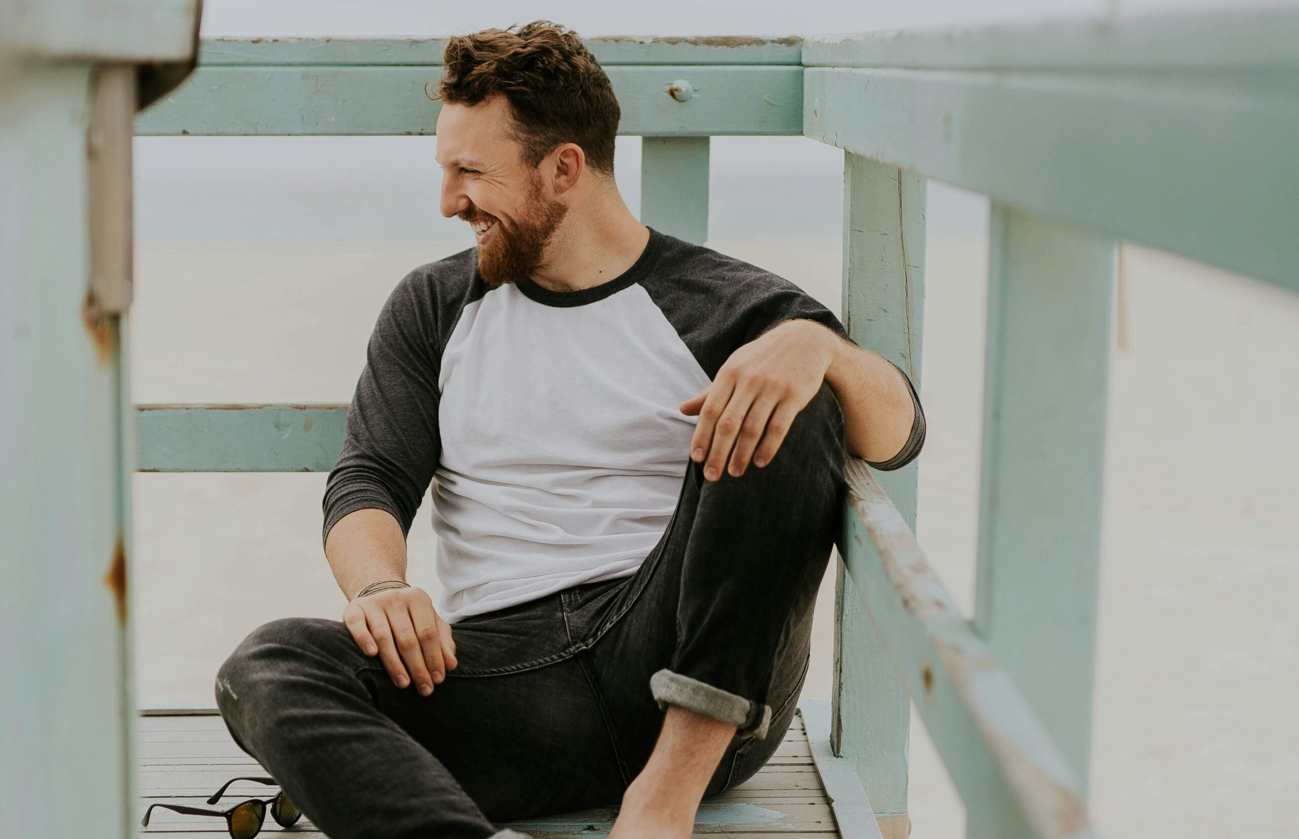 Man smiling in picture at the beach
