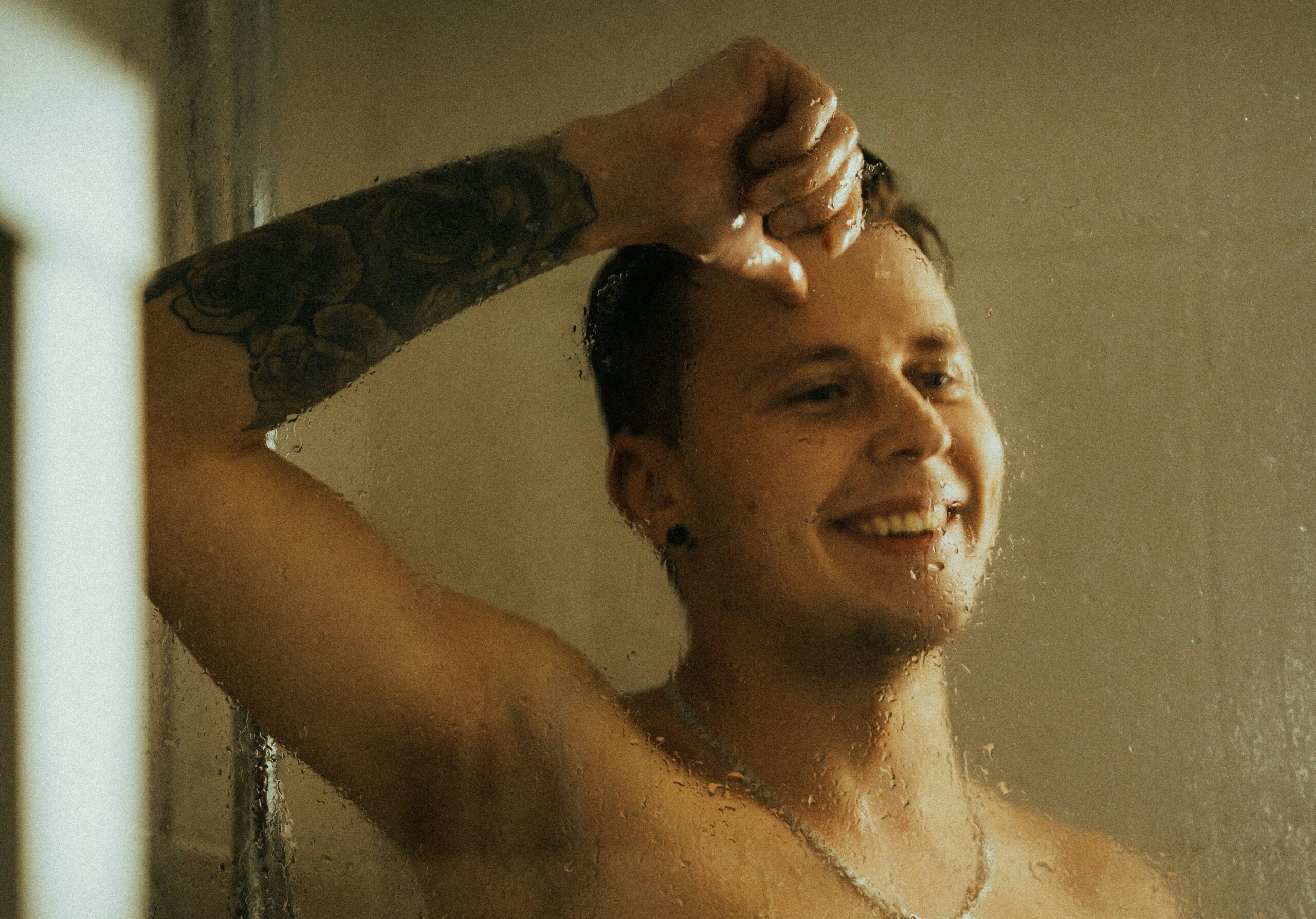 man in shower manscaping