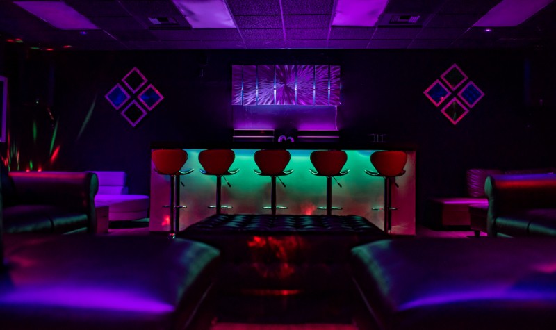 red chairs neon lights 