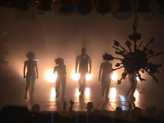 Five people performing on the stage