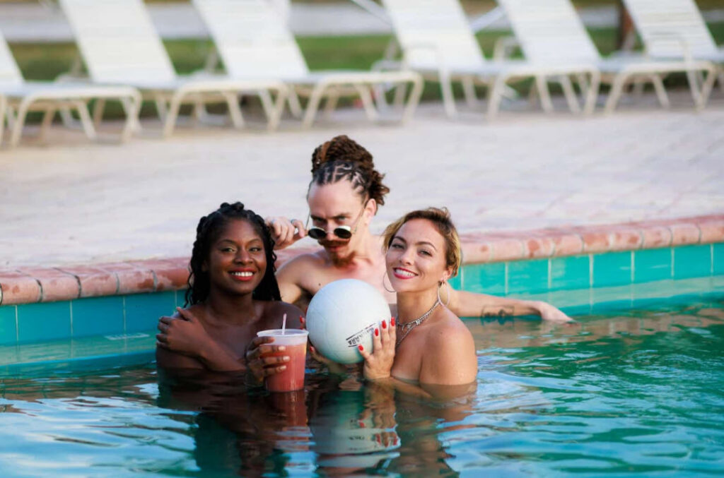 Three people in the pool at the resort