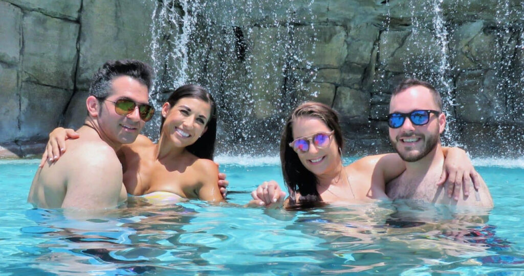 Picture of couples in the pool at Caliente Lifestyle Resort