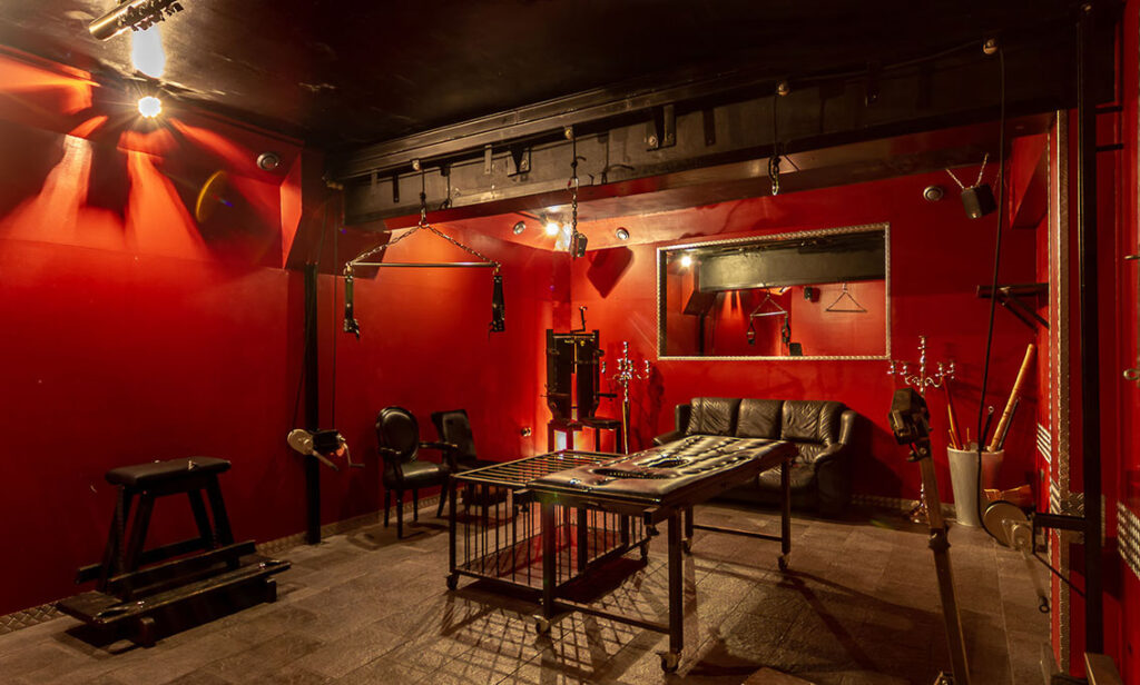 red wall black couch