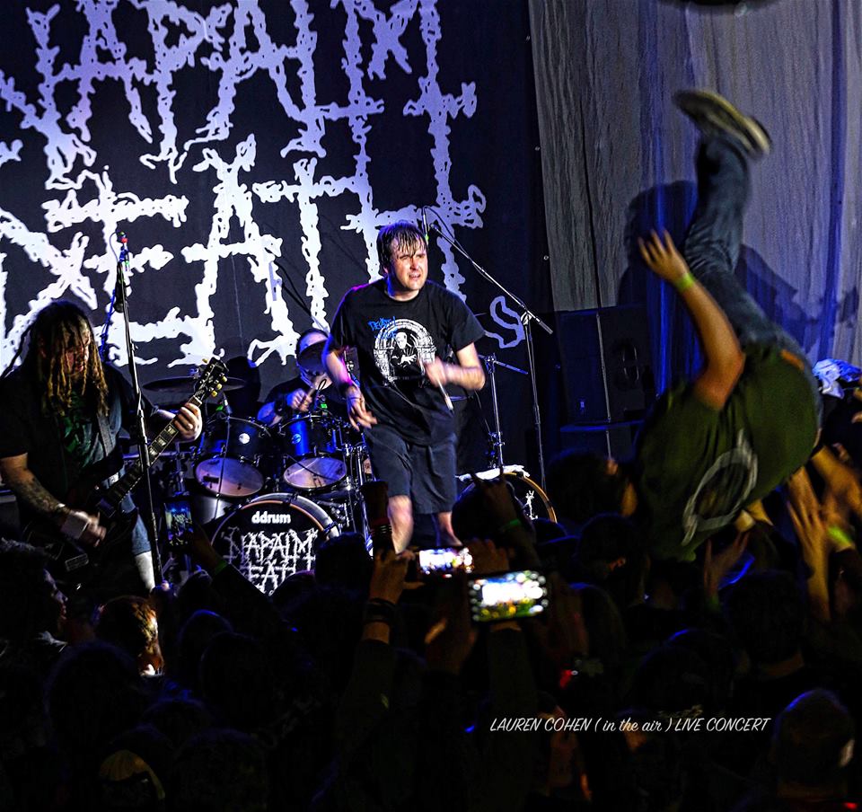 A man standing in the stage of the club