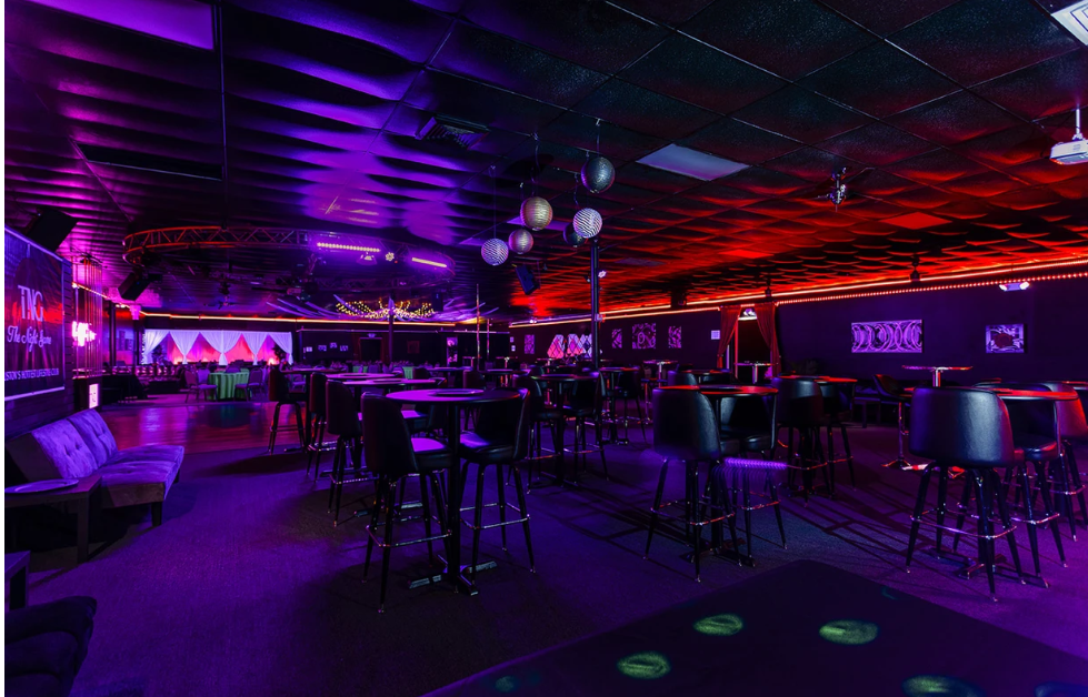 Photo of tables and chairs at swingers club Night Game Houston