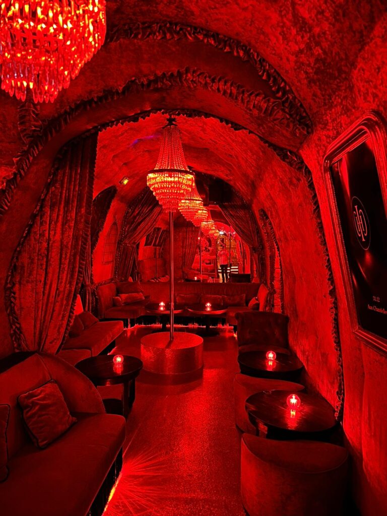 red room,lights,couch and carpet
