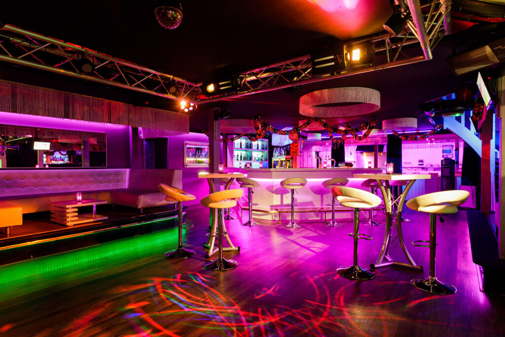 disco lights with white table and chairs