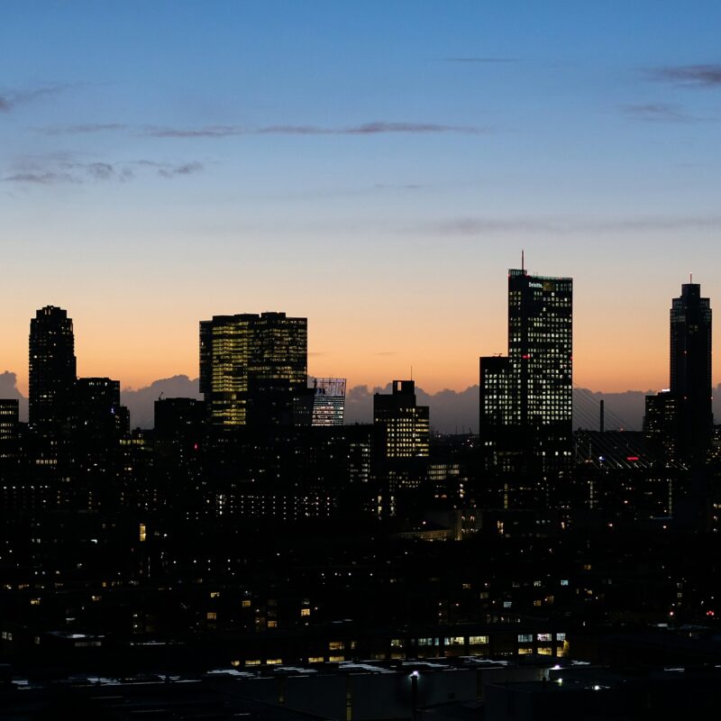 a view of a city skyline at dusk