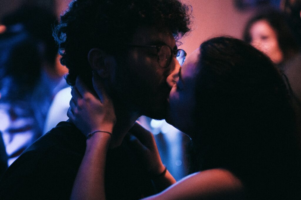 a couple of people that are kissing each other