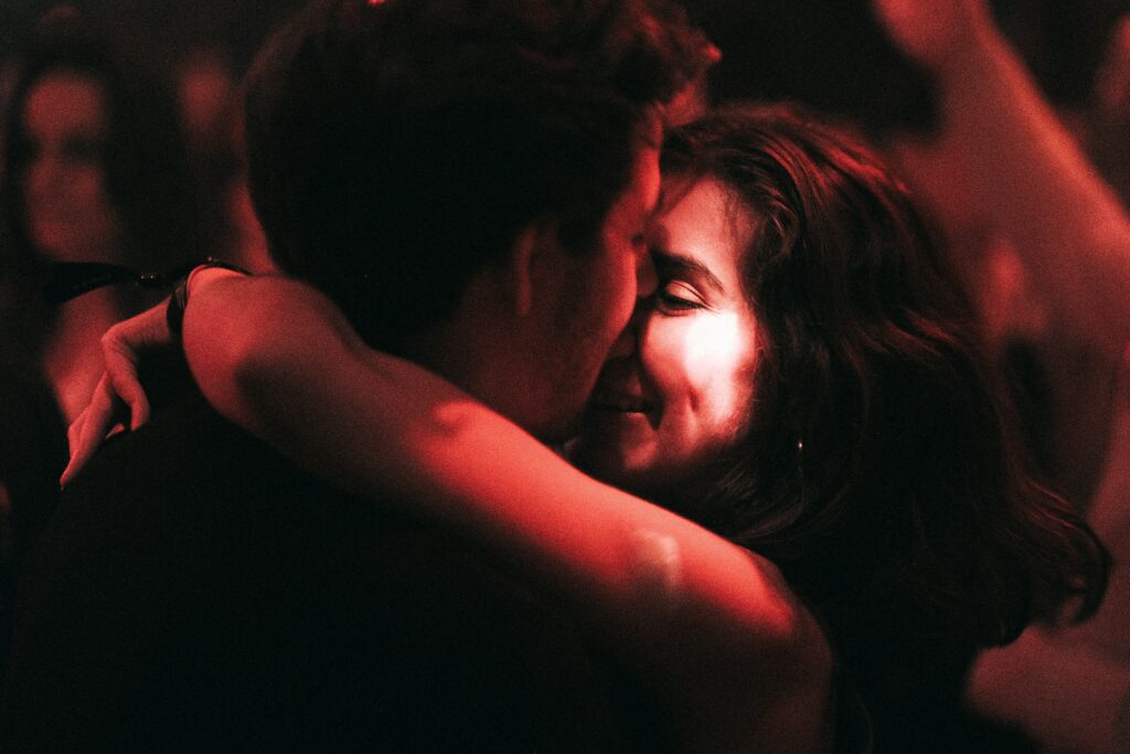 a couple of people that are hugging each other