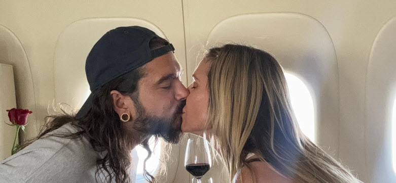 Heidi Klum and husband Tom kissing