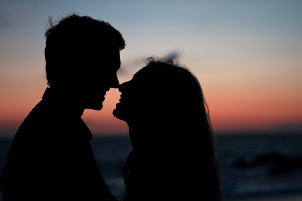 An image of a man and woman in sunset