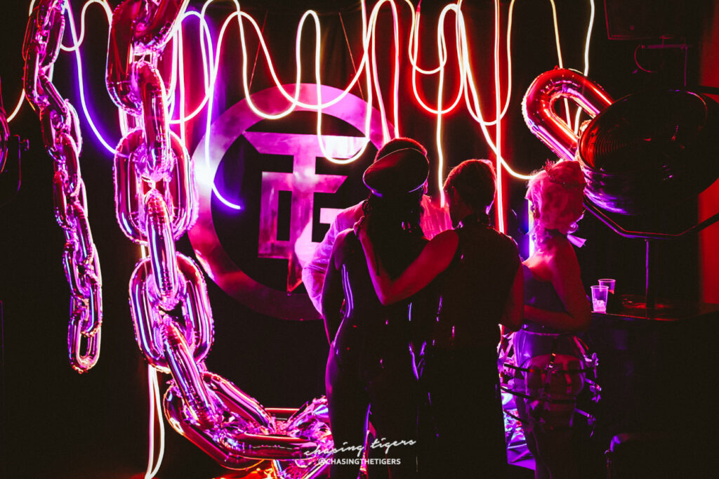 Image of three people standing in the club