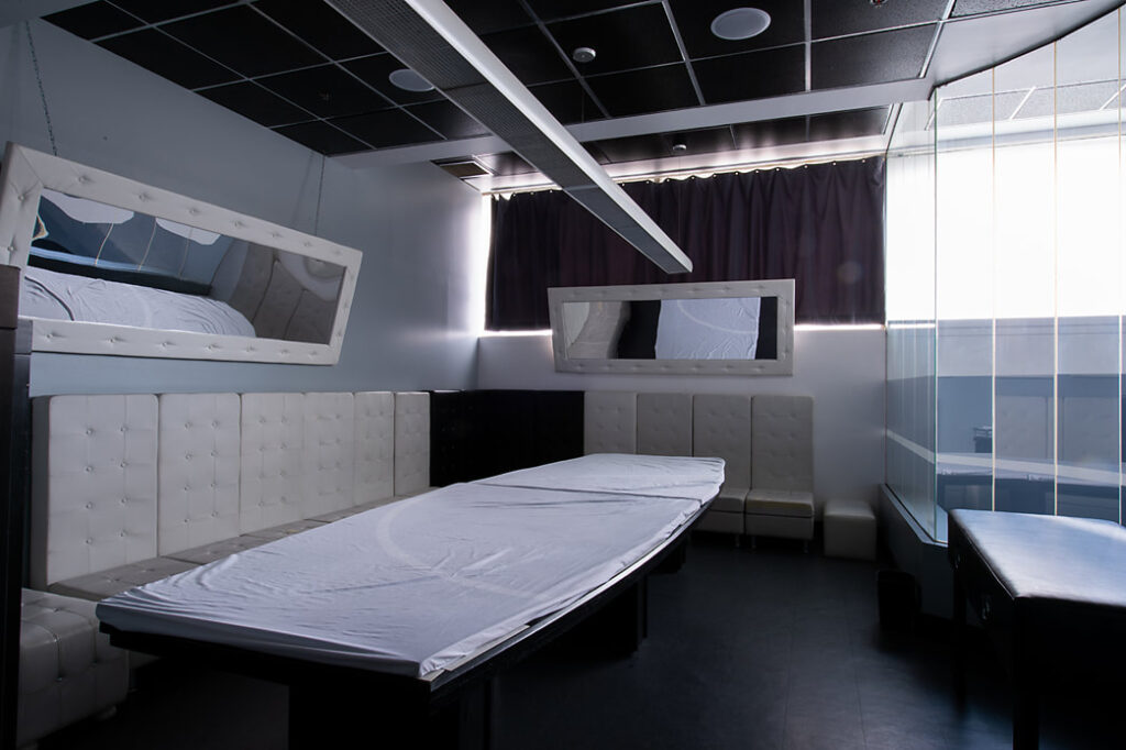 Image of bedroom with mirror and shower