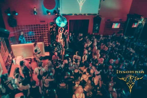 People standing and dancing in the club