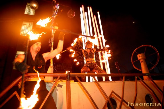 A man in the stage holding fire in the stage