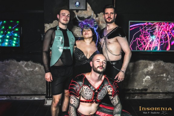 Four people with costumes standing