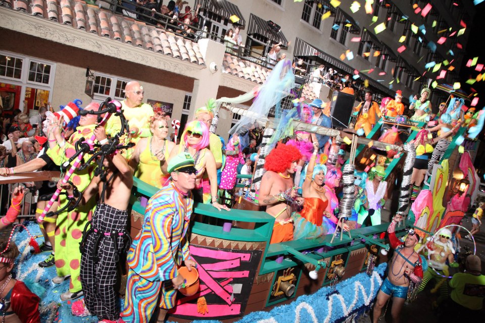 People having parade in the street wearing costumes