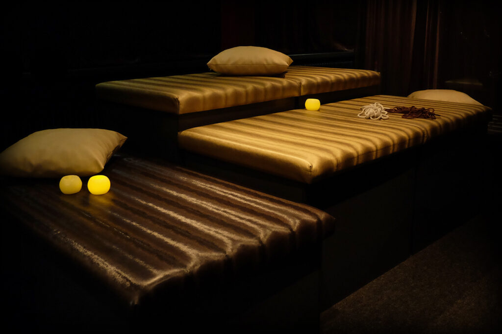 Image of bed with lights and rope
