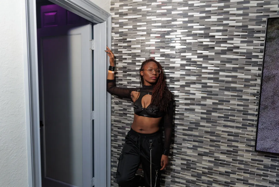 A woman holding a fan