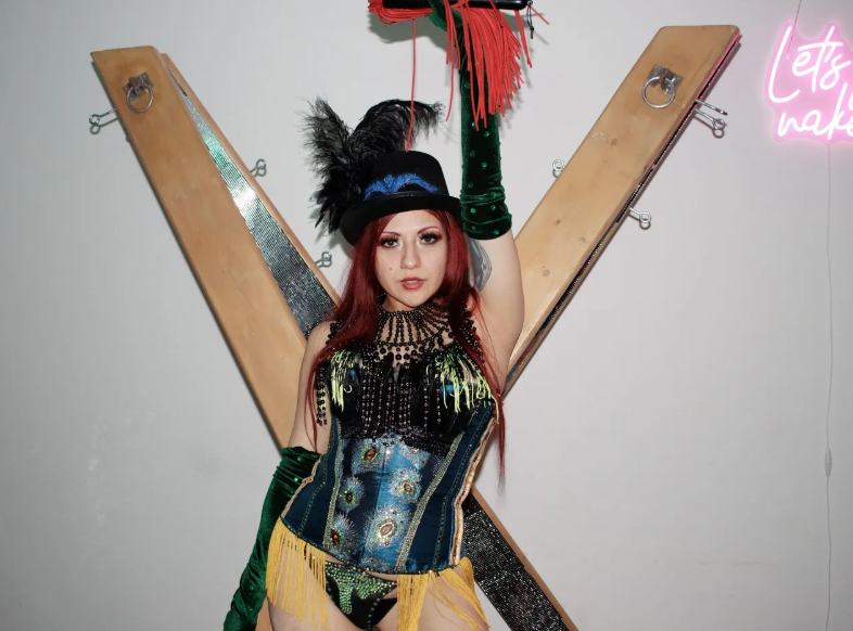 woman standing in the X wood