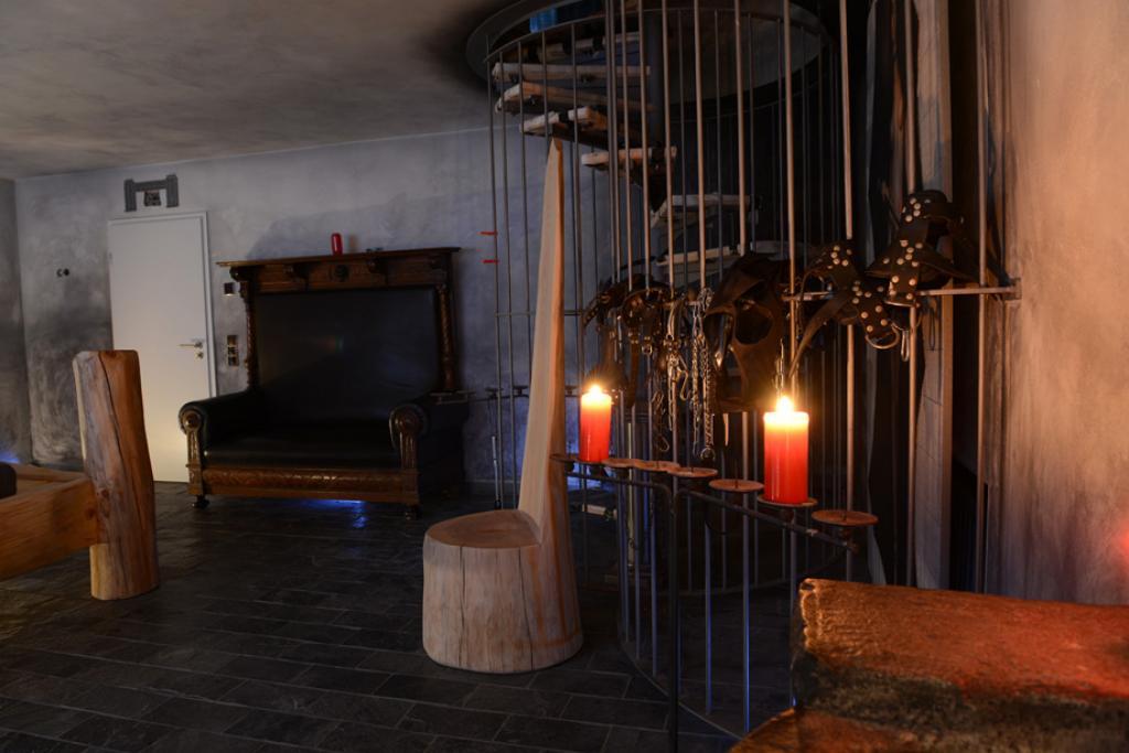 A room with big master chair and candles