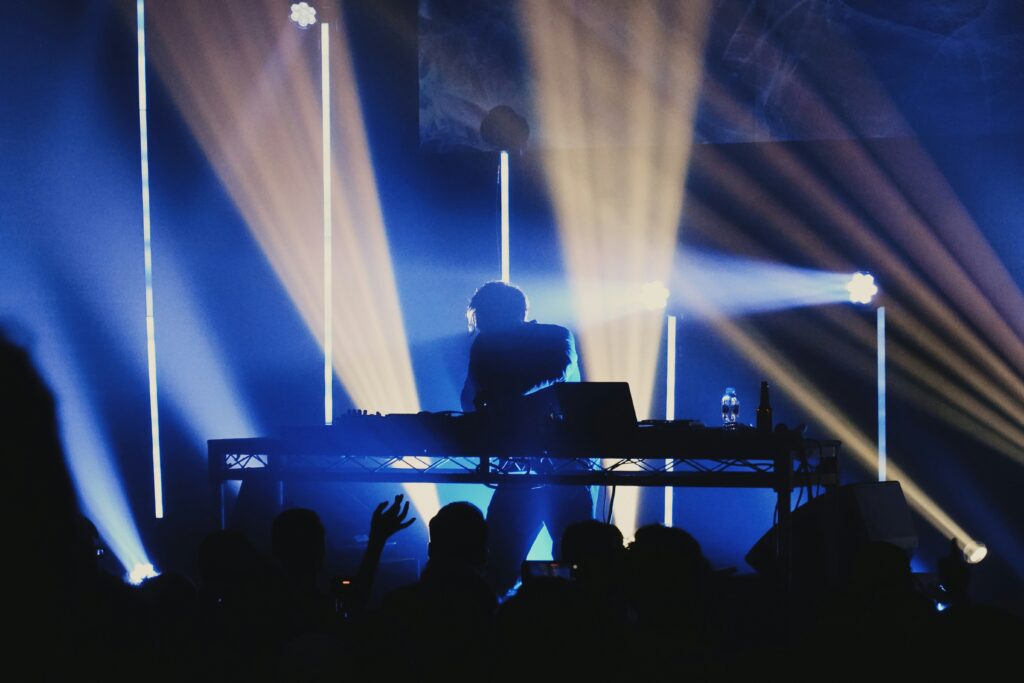 A man holding his equipment for music in the stage