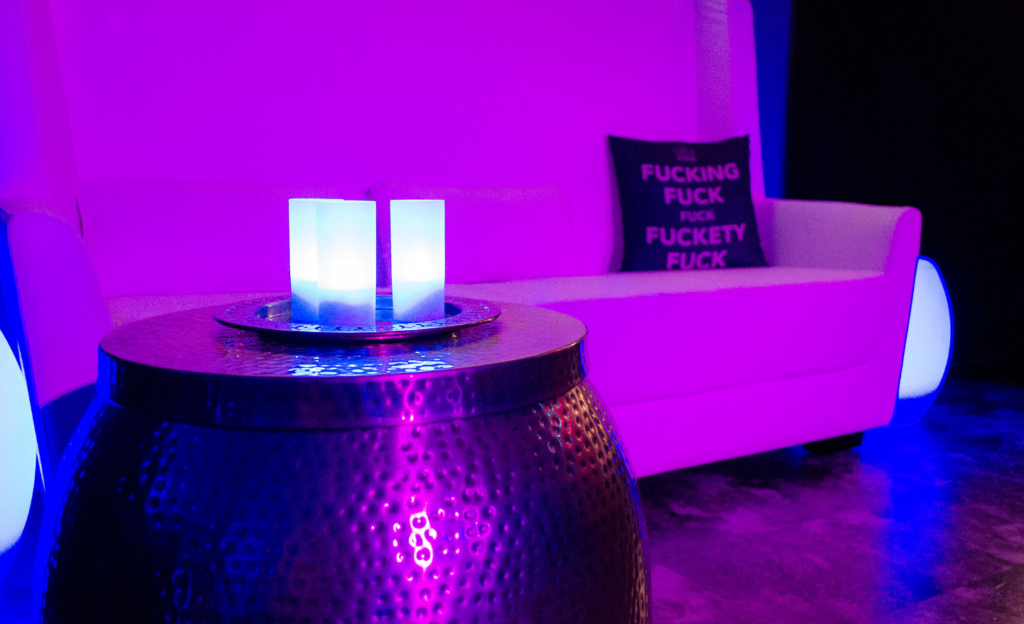 Big sofa in the club and a table